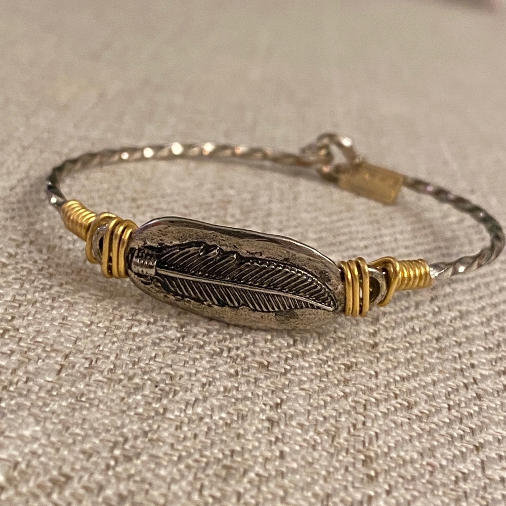 Handmade gold and silver bracelet with Feather